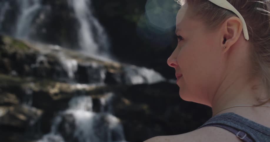 Woman Hiking Through Woods