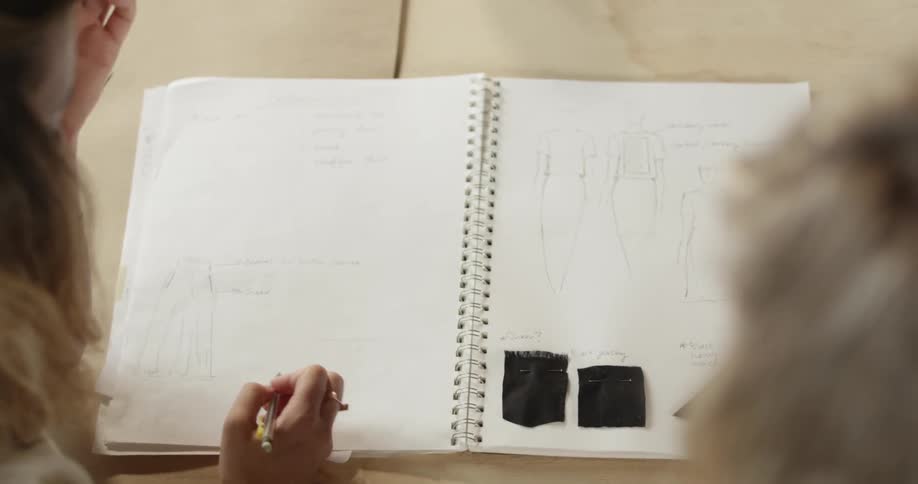 A person writing on paper