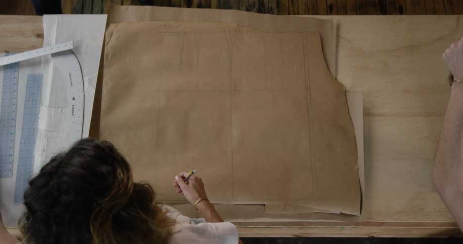 A woman is working in her living room