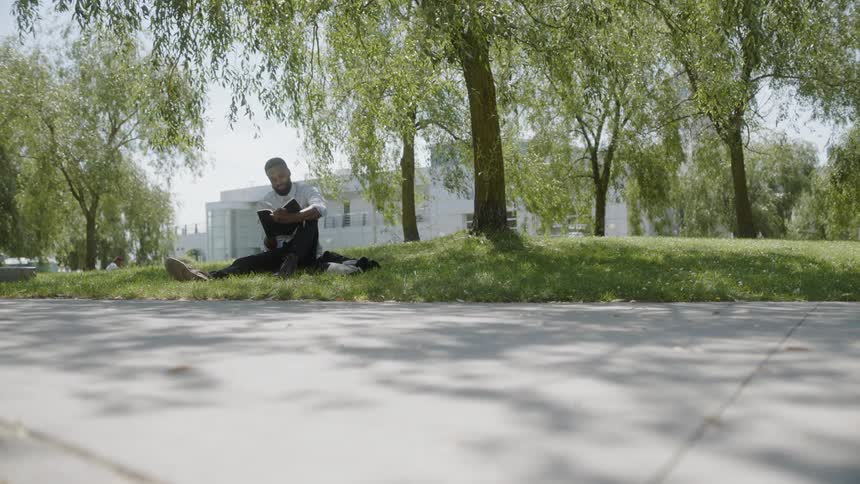 A man with a book in the park