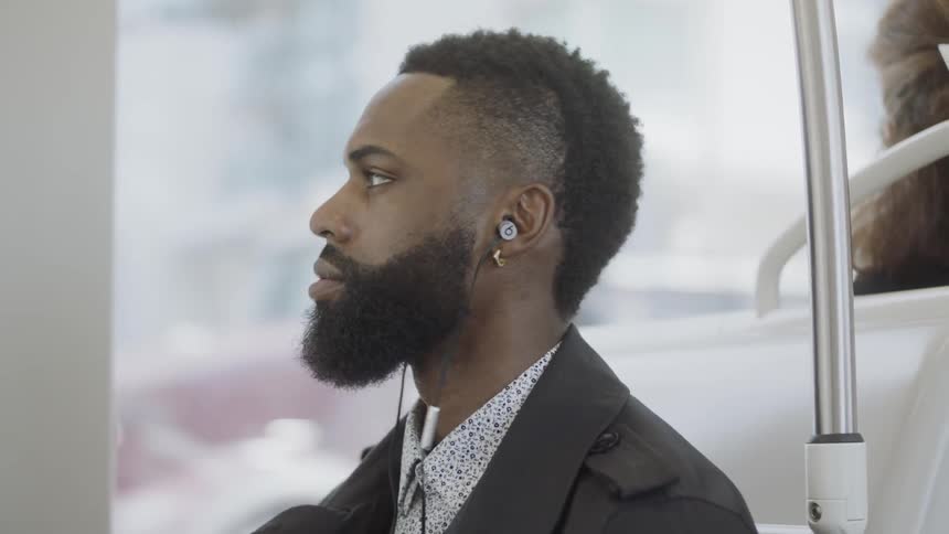 A man bobbing his head to his music
