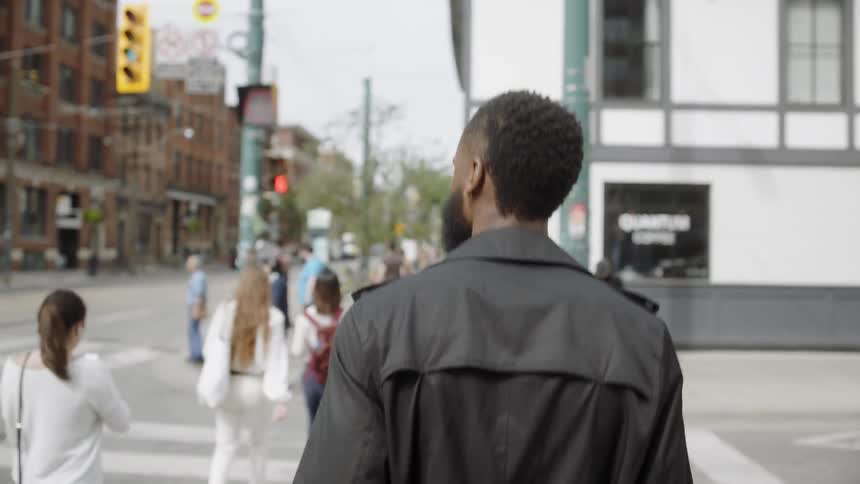 Man crossing a street on a pedestrian crossing