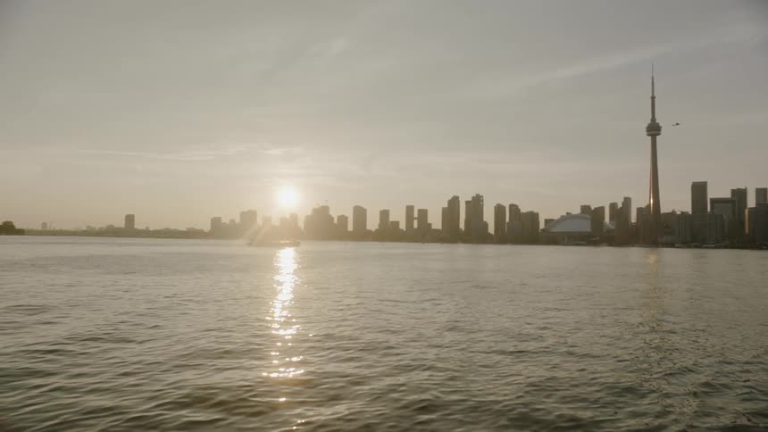Body of water with city skyline in background
