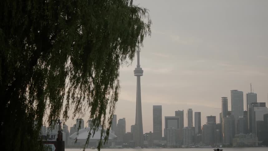 A cityscape in front of a river front