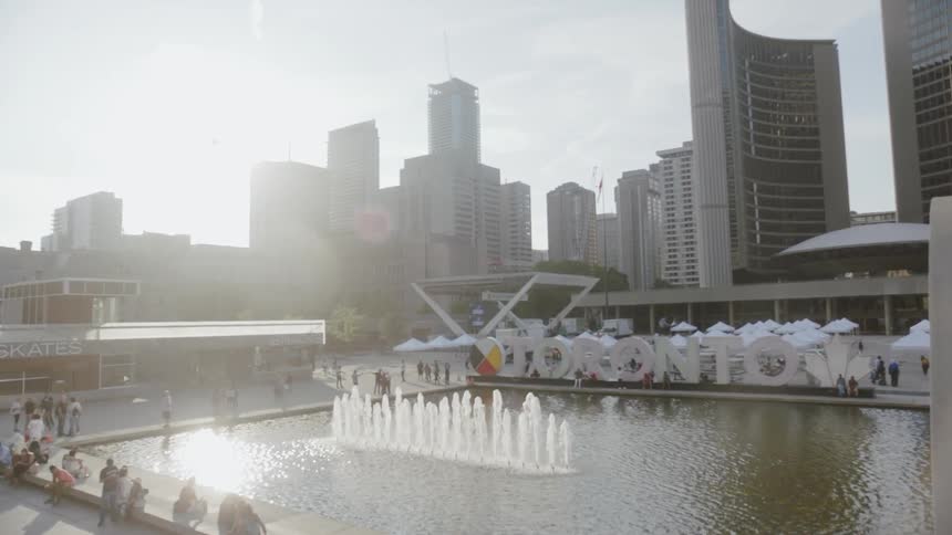 People are gathered around a fountain