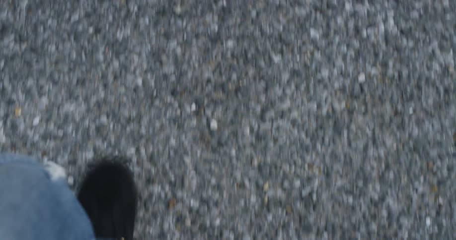 A man is walking outdoors