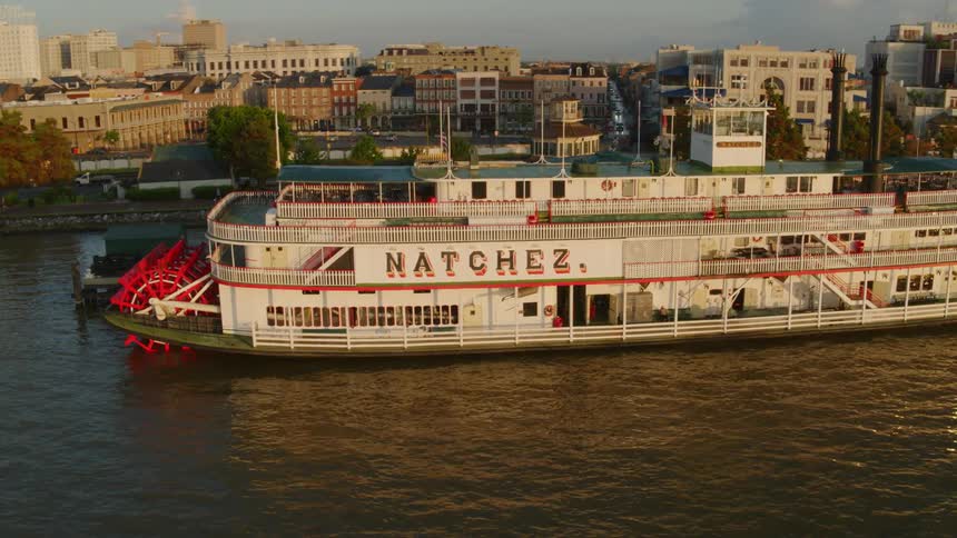 Riverboat docked near buildings