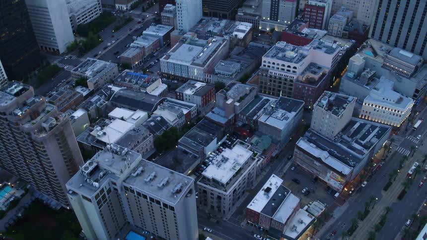 The camera flies over a dense city