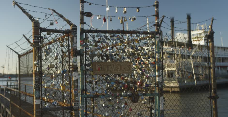 Chain link fence with a lot of locks hanging on it