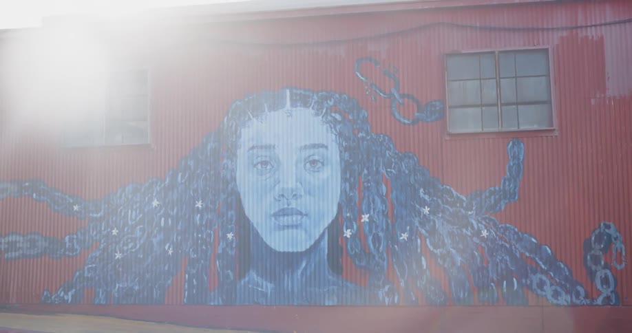 Art painting of a woman on metal building