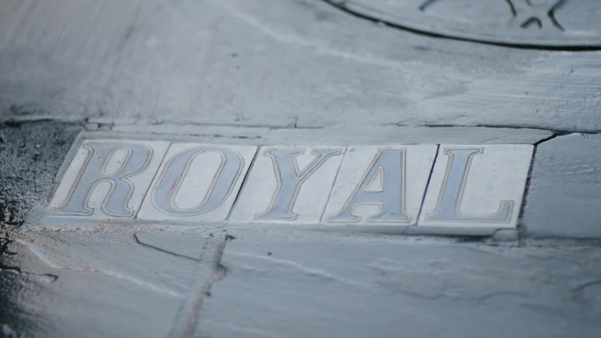 A close up view of a sign mounted on stone