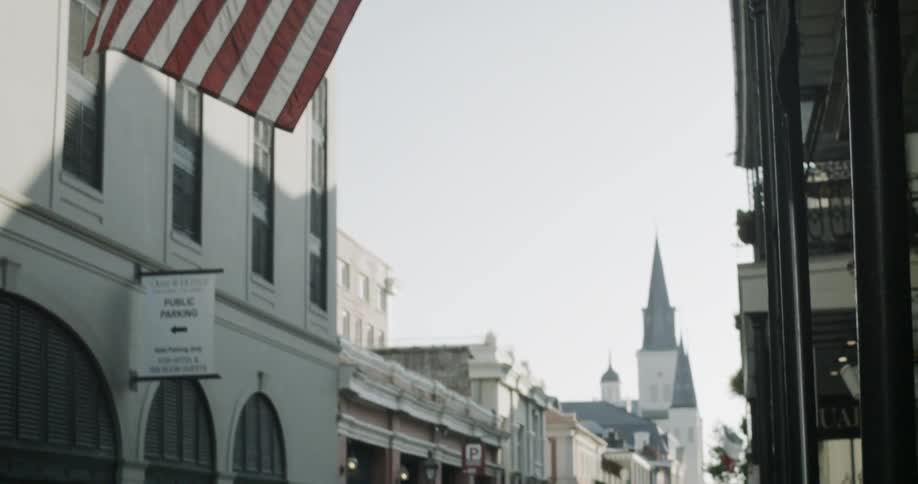 American flag over historic city street