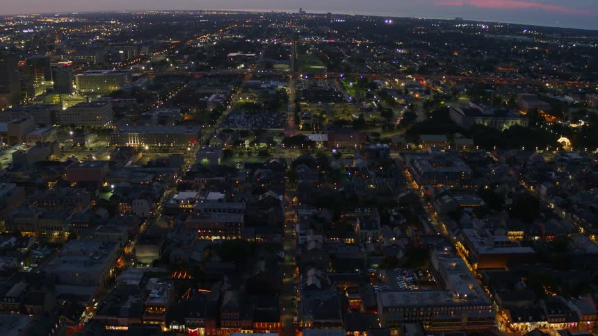 Aerial photography of a large city full of lights during sunset