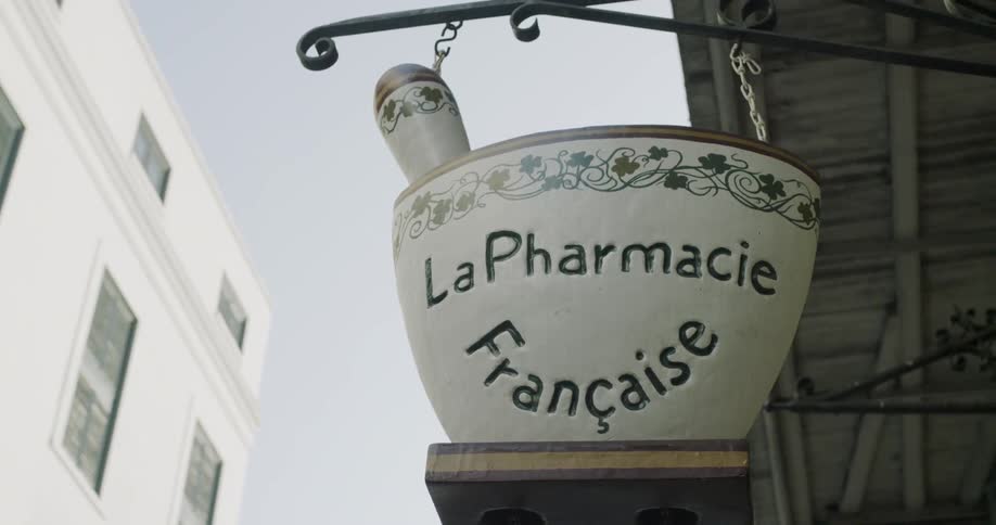 A close shot of a sign for a pharmacy