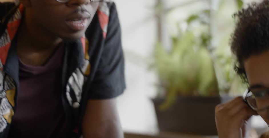 Two black male talking and mingling together