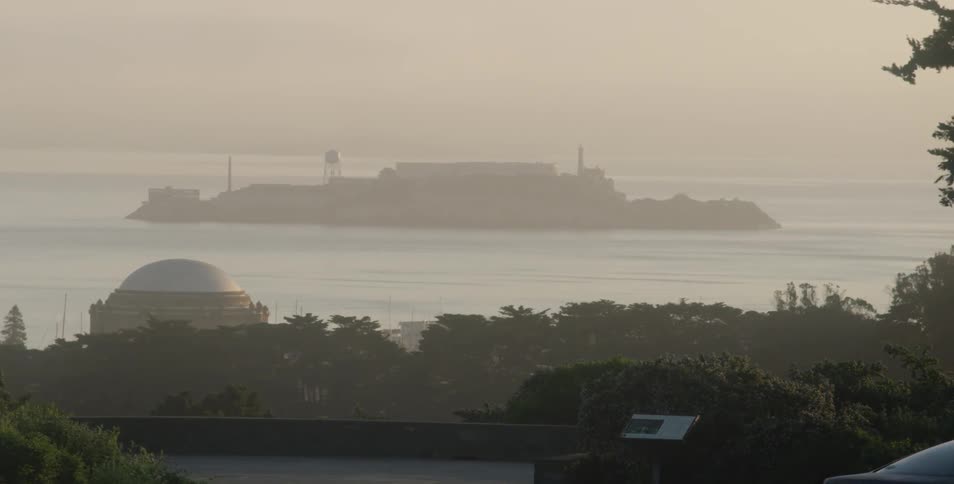 A small island just off the coast during sunrise