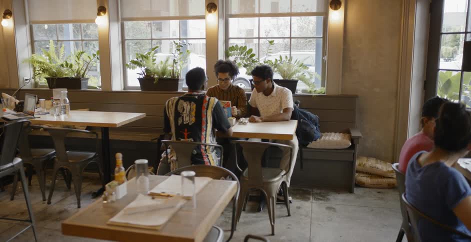 Males meeting up at a restaurant to eat