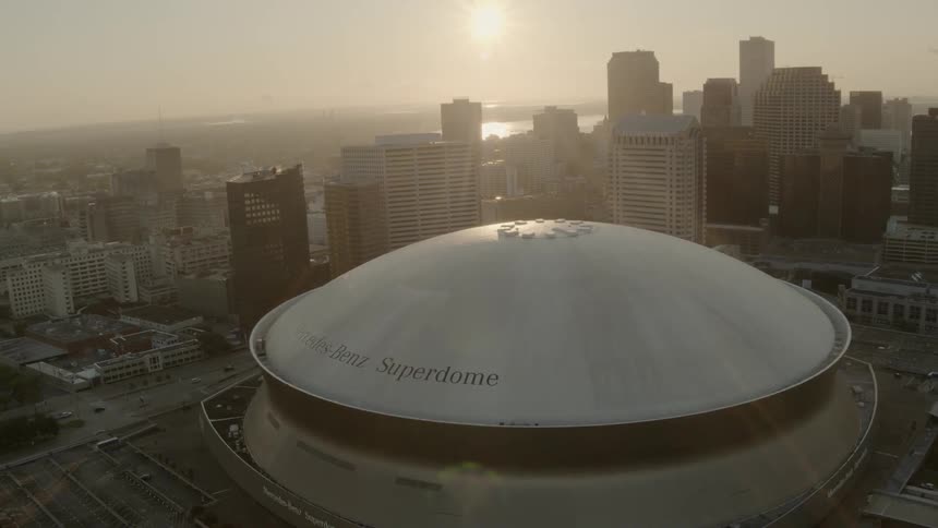 A super dome sits in the middle of a city center filled with skyscrapers