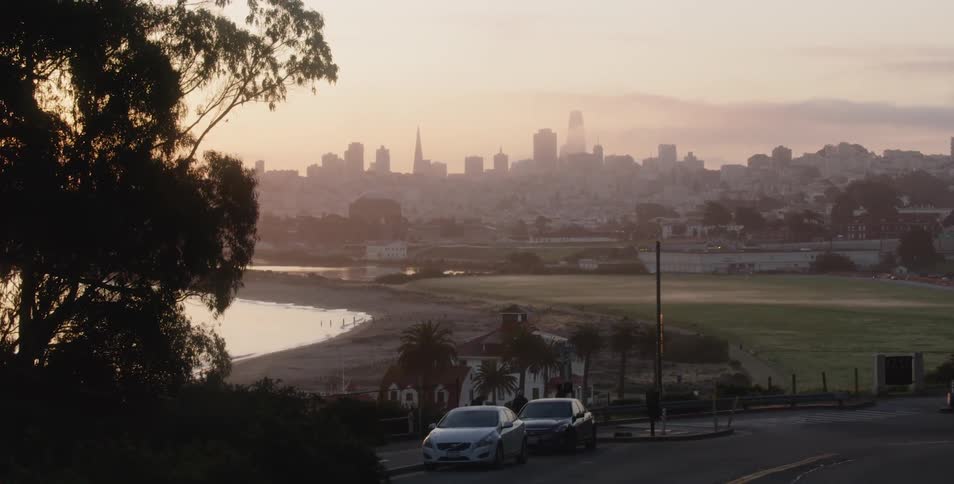 View of city skyline from street at dawn