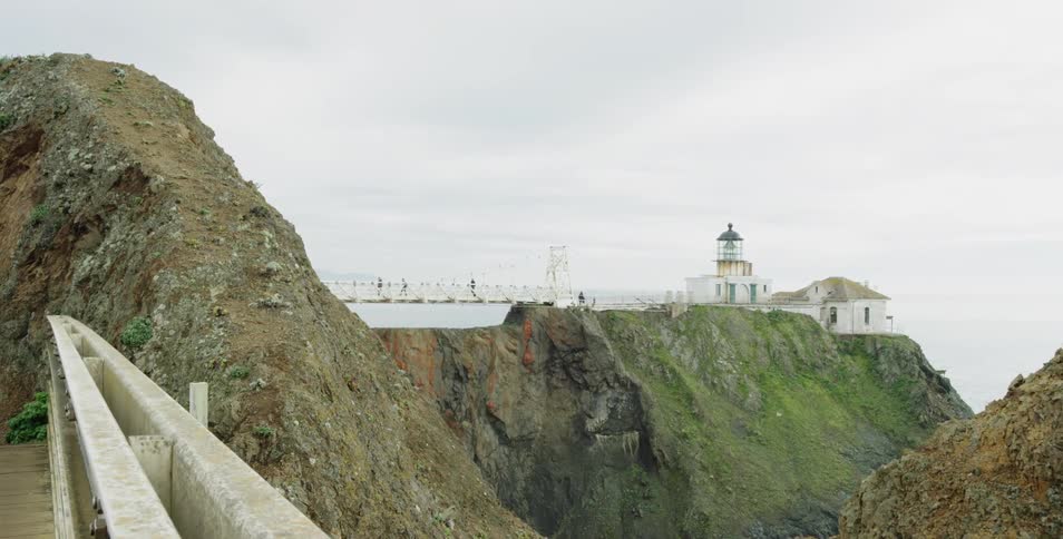 A view of a cliff building and the sea behind it all