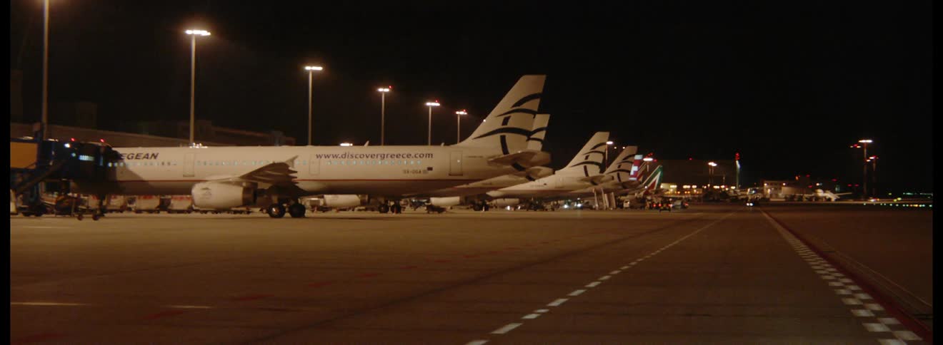A row of planes on the runway
