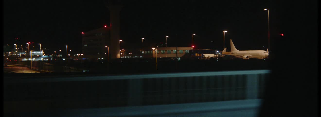 Airplanes parked at airport gates
