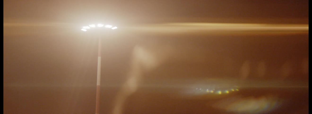 Lights from a tower refract through a lens