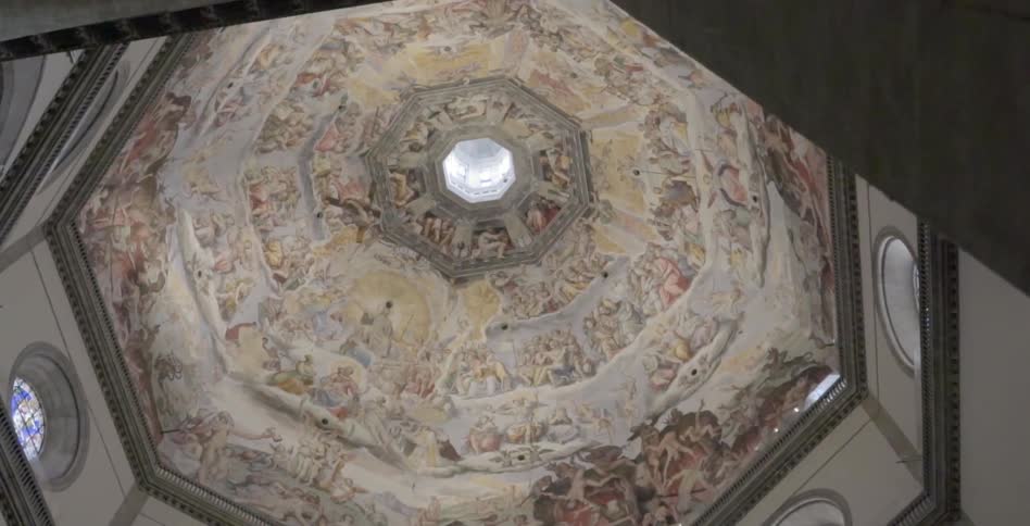 Paintings on a domed ceiling inside a building