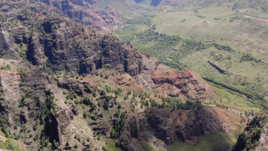 Aerial view of grassy mountain and canyon