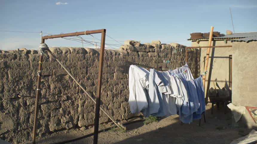 Linens hang on a clothesline