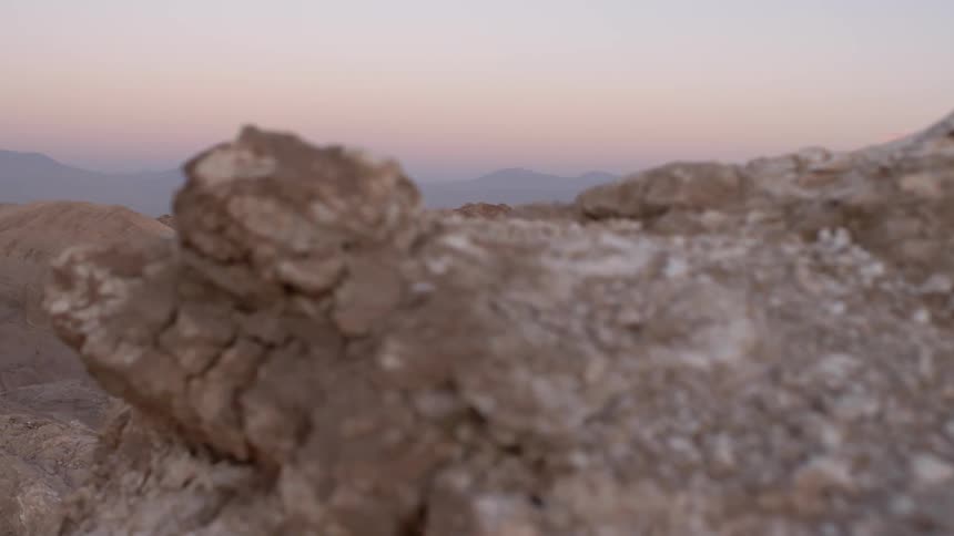 Rock formations cover the ground in the desert