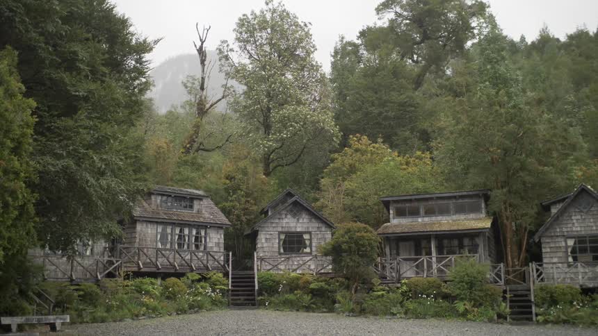 Several buildings in a wooded area