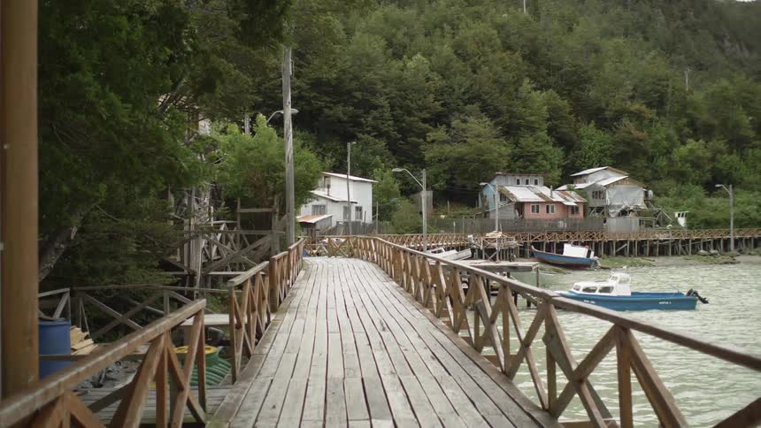 A large dock sits on the outer edge of the water
