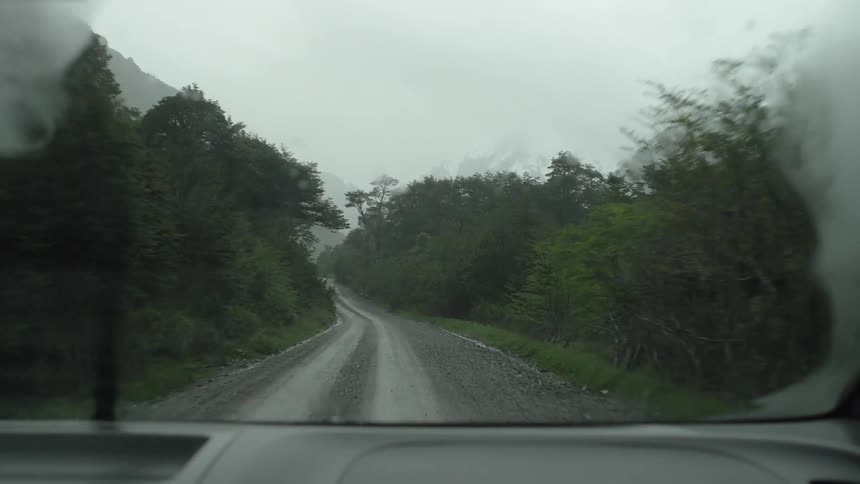 Windshield wipers wiping away the rain on a vehicle