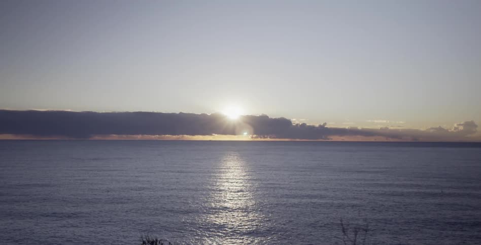 The sun is shining over the ocean