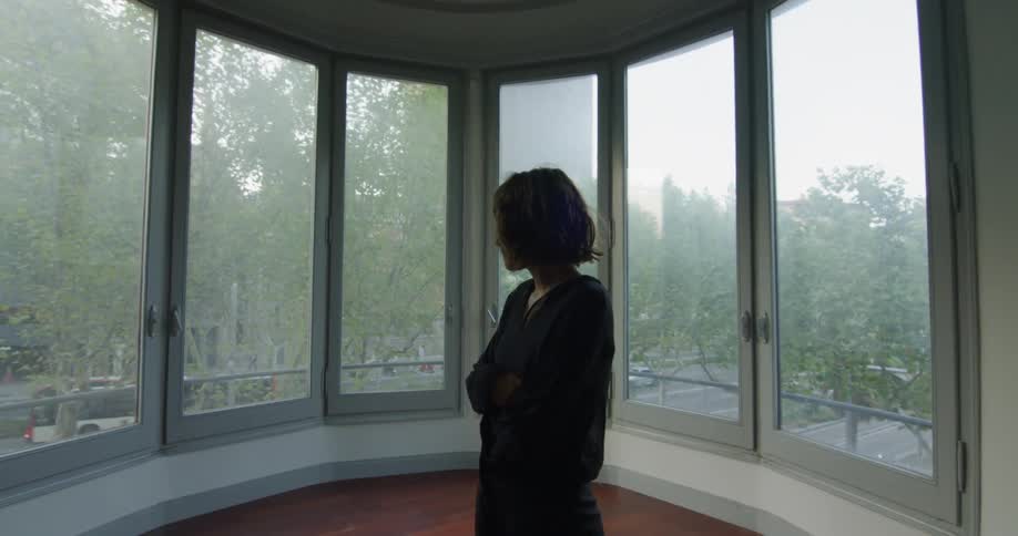 A woman in a windowed area