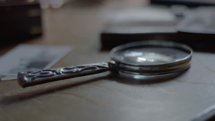 An old magnifying glass on a table