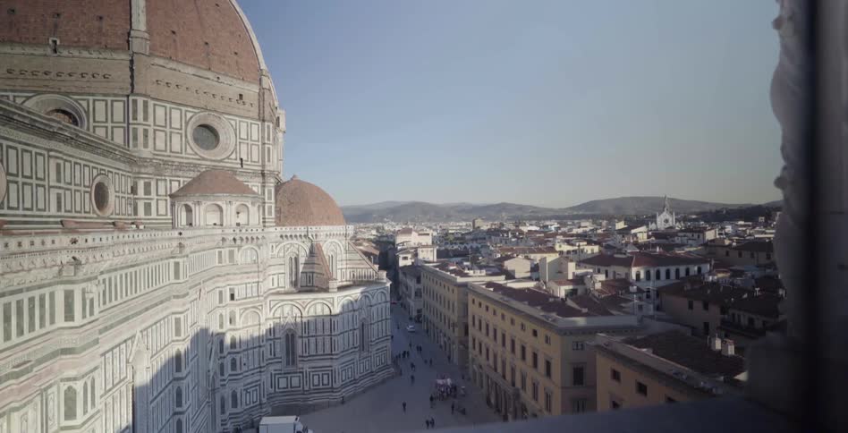 A city is shown during the day