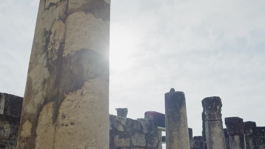 Weather battered columns of an ancient ruined structure