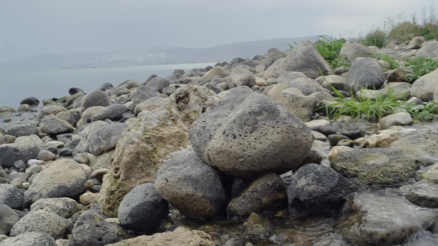 A stream running through rocks into the sea