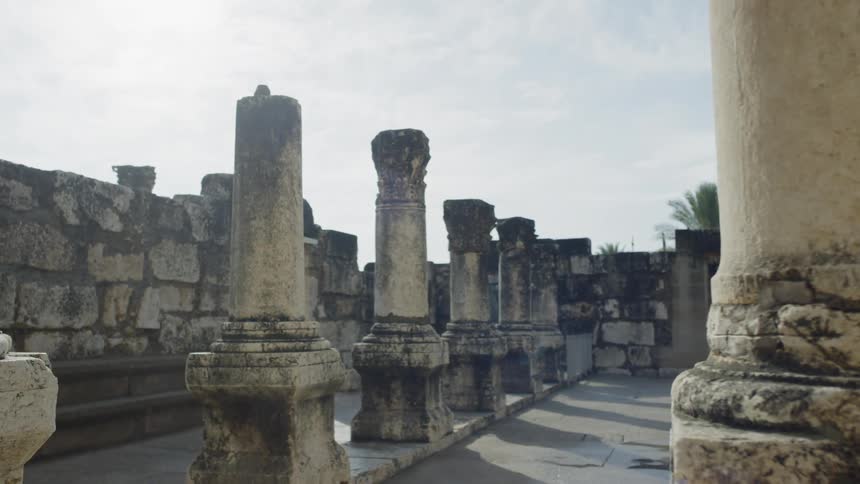 Old pillars stand at an archaeological site