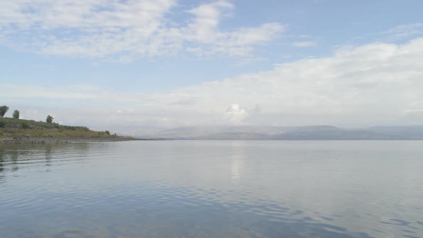 A lake reflecting the sky during the day