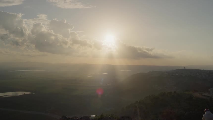 Sunlight shines over rural hills