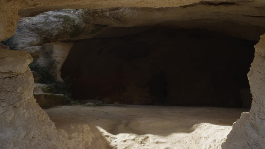 A cave with the sunlight shining on its floor