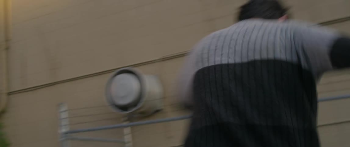 A man turns in circles on a skateboard