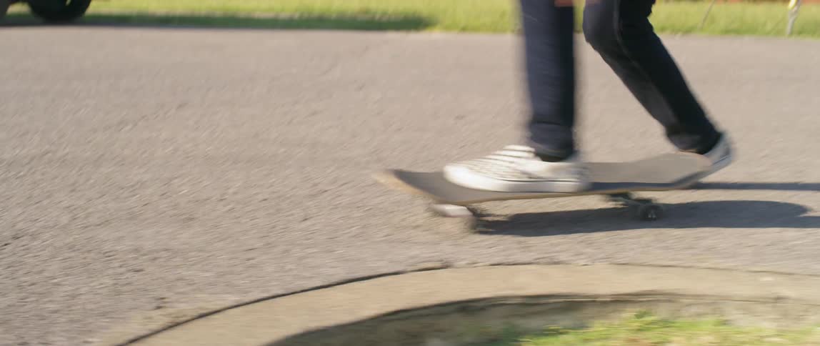 Person in checkered shoes skateboarding