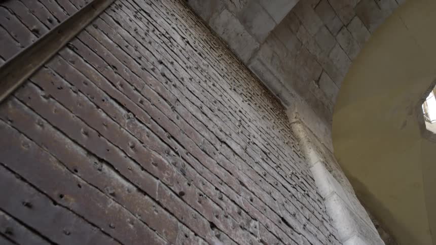 A brick wall that extends on to the ceiling