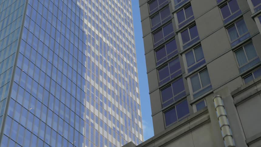 Three city buildings in the daytime