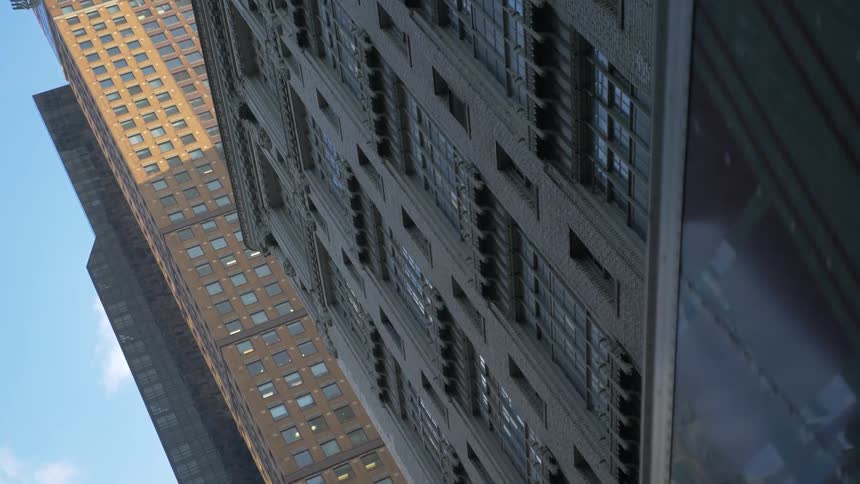 View looking up at large buildings from city street