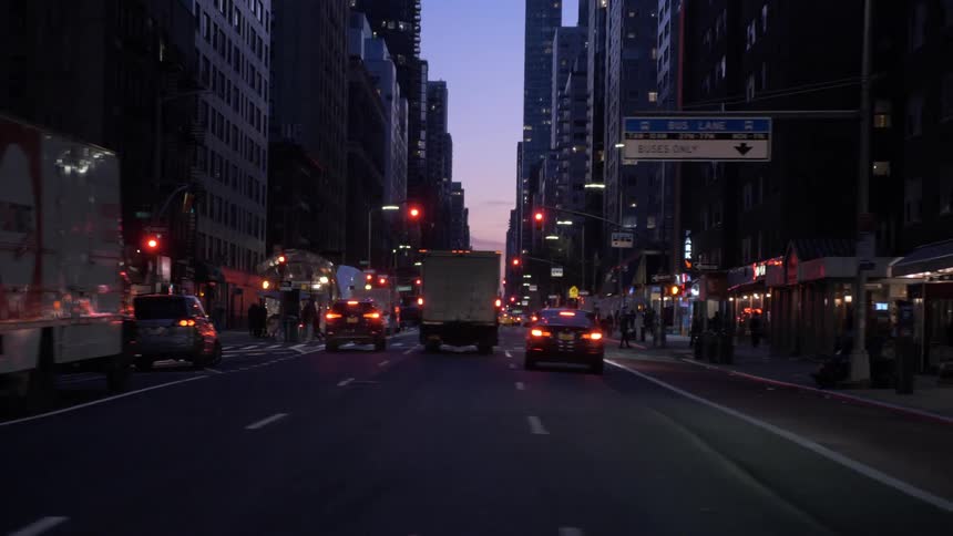 A wide city street at sunset